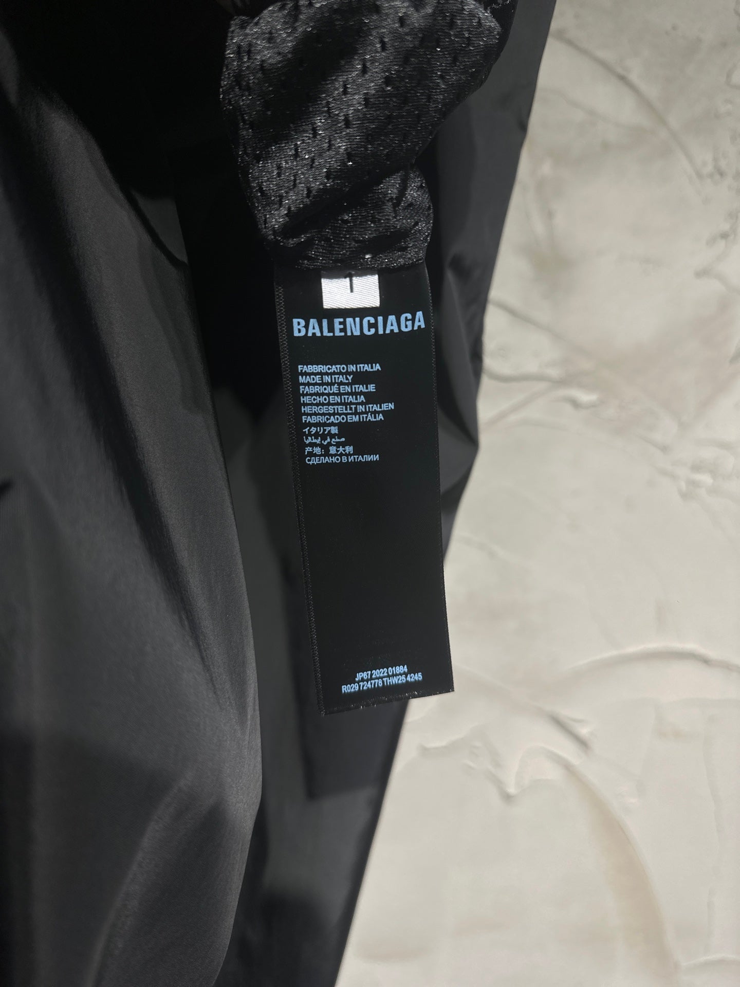 Black pants with inner fabric label tag near waistband