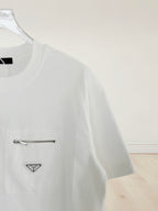 White short-sleeve T-shirt with chest logo patch and metal zipper detail