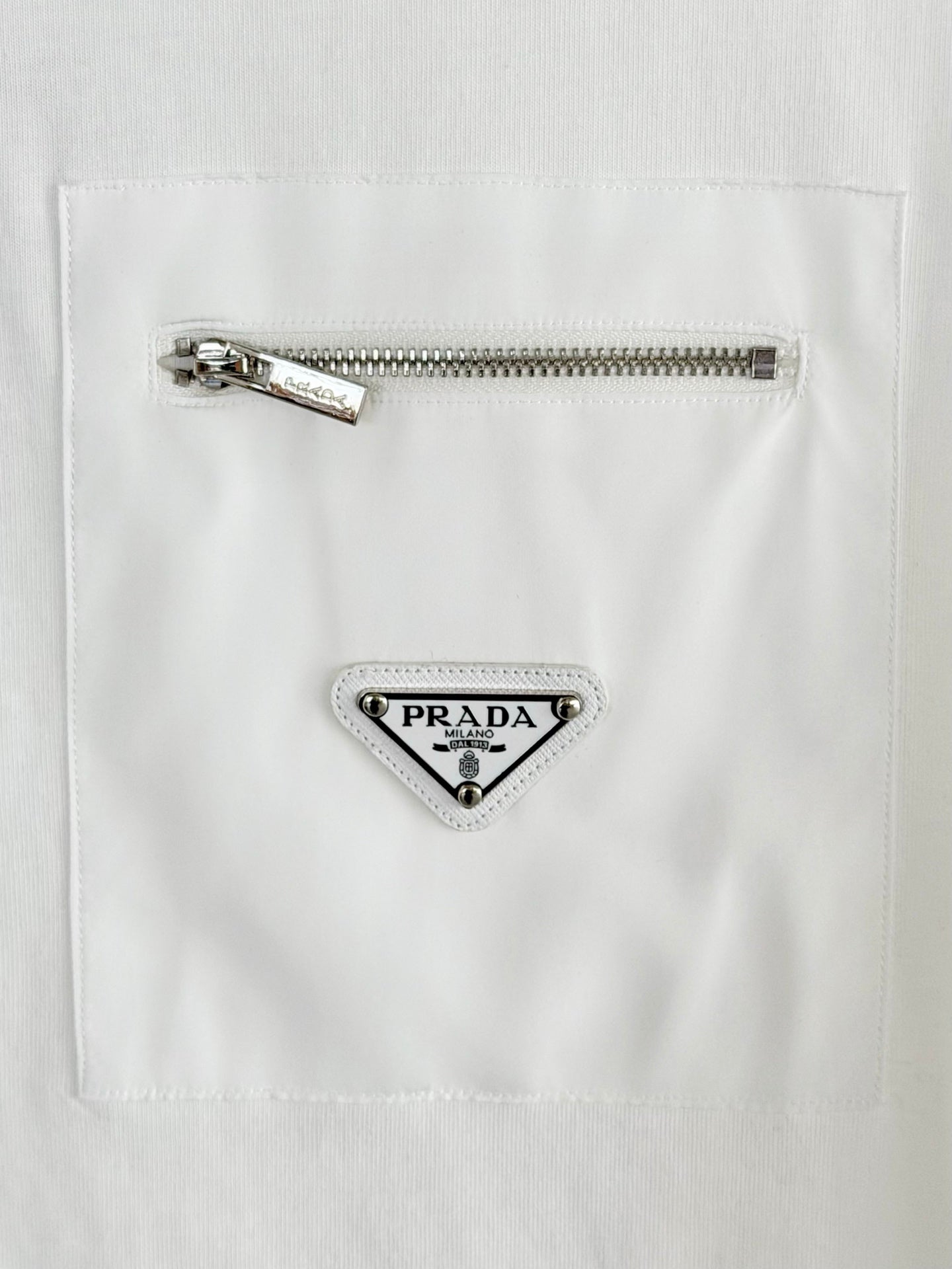 White T-shirt with metal zipper and triangular Prada Milano logo patch