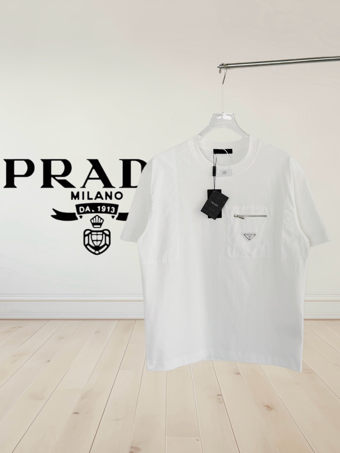 White short-sleeve T-shirt with chest pocket and Prada logo patch