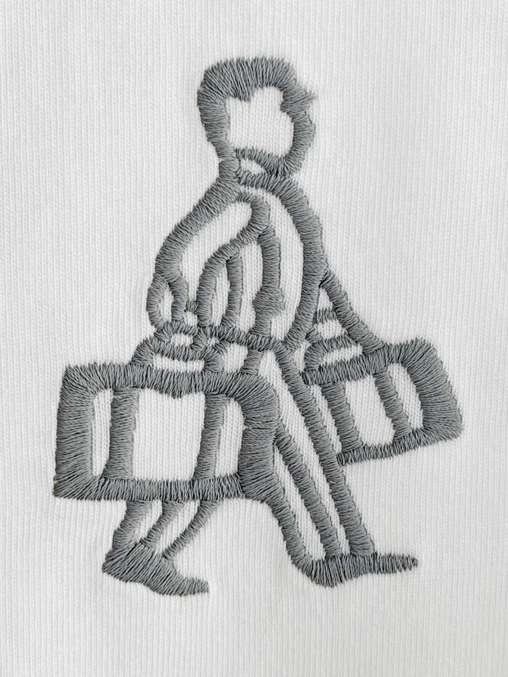 Embroidered gray figure holding a box on white Prada T-shirt