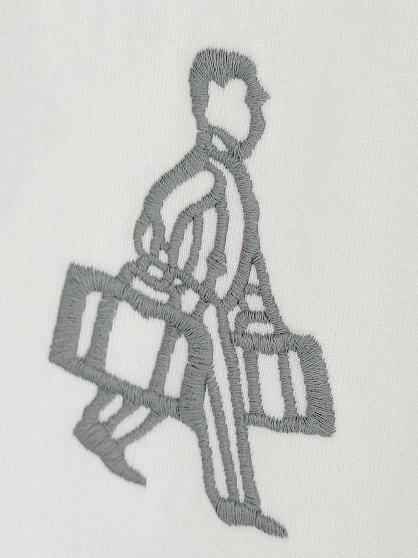 Embroidered gray figure holding a bag on white Prada T-shirt