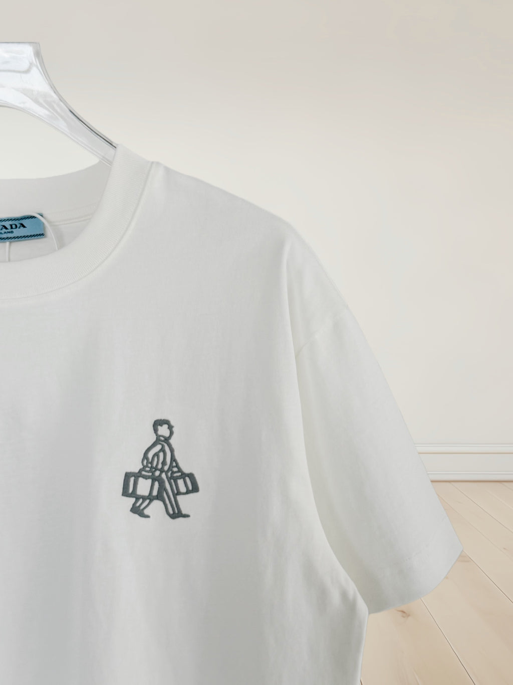 White Prada T-shirt with small front emblem graphic