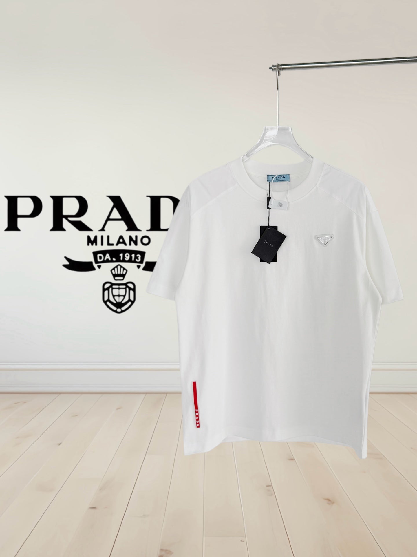 White short-sleeve crewneck T-shirt with Prada logo and hanging tag