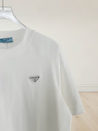 White crewneck T-shirt with small triangular Prada logo patch