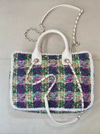 Chanel tweed handbag with white top handles, multicolor sequin-like weave, chain straps