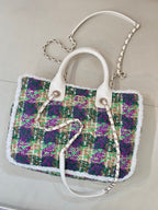 Chanel tweed handbag with white handles and silver chain strap, multicolor sparkly texture
