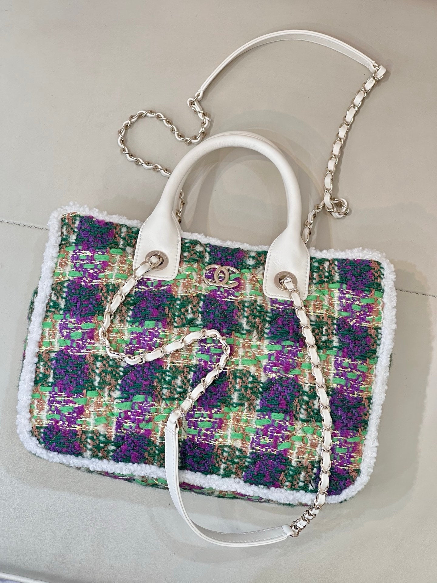 Chanel tweed handbag with white handles and silver chain strap, multicolor sparkly texture