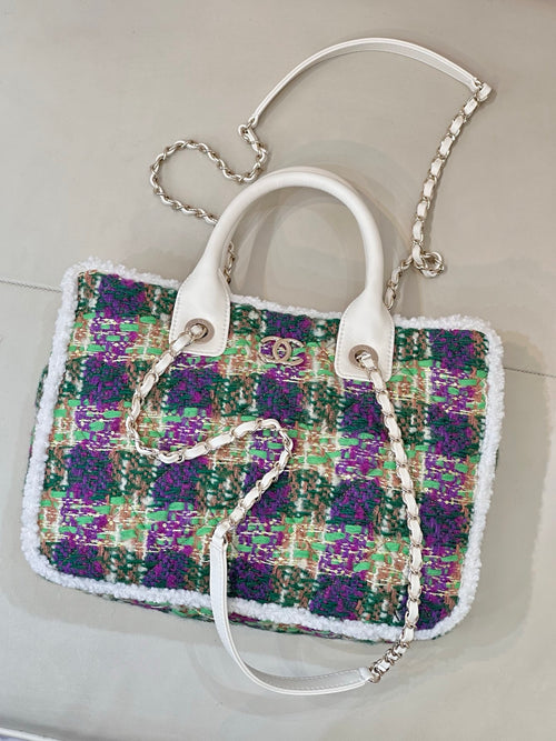 Chanel tweed handbag with white handles and silver chain strap, multicolor sparkly texture