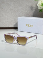 Dior sunglasses with lilac translucent frames and light tan tinted lenses