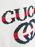 White T-shirt chest Gucci logo close-up, embroidered lettering