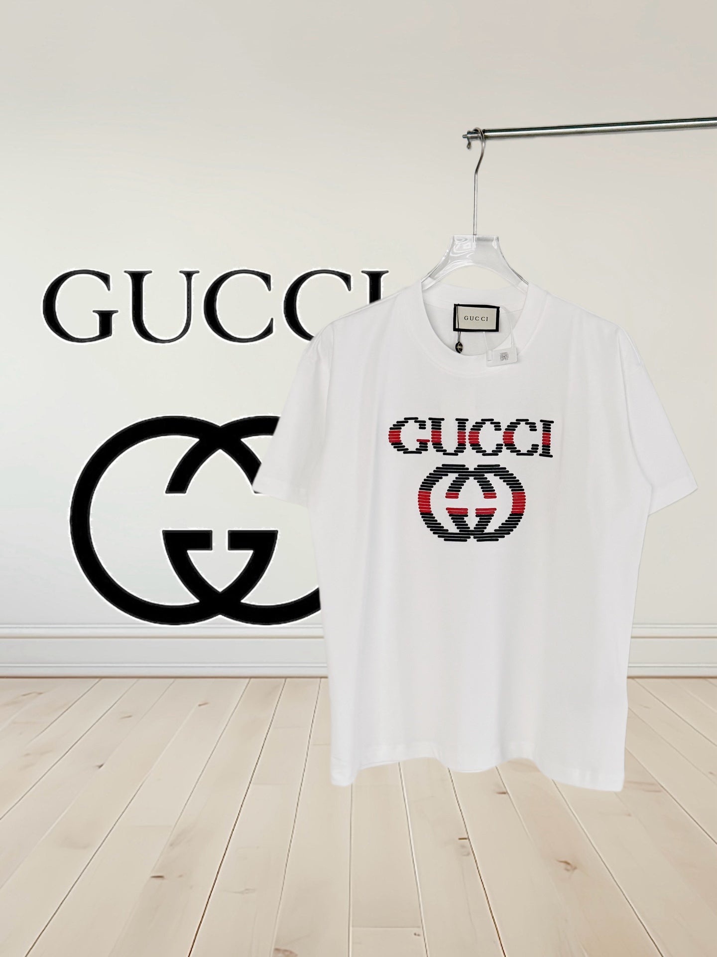 White crew-neck T-shirt with multicolor Gucci logo chest print