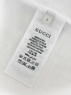 White T-shirt care label with size and Made in Italy information