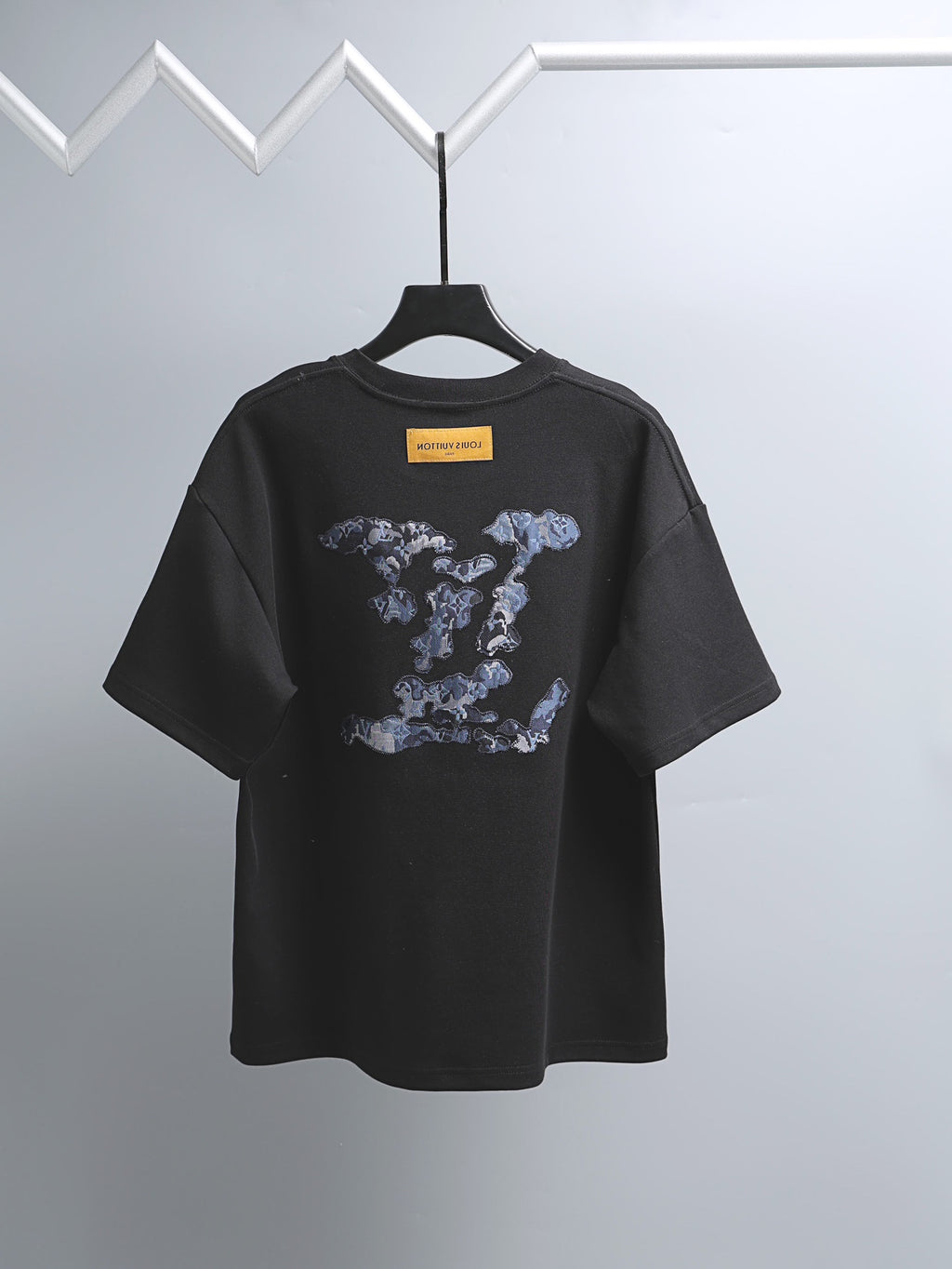 Black graphic T-shirt with short sleeves and crew neck
