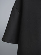 Black short-sleeve T-shirt side view with curved hemline