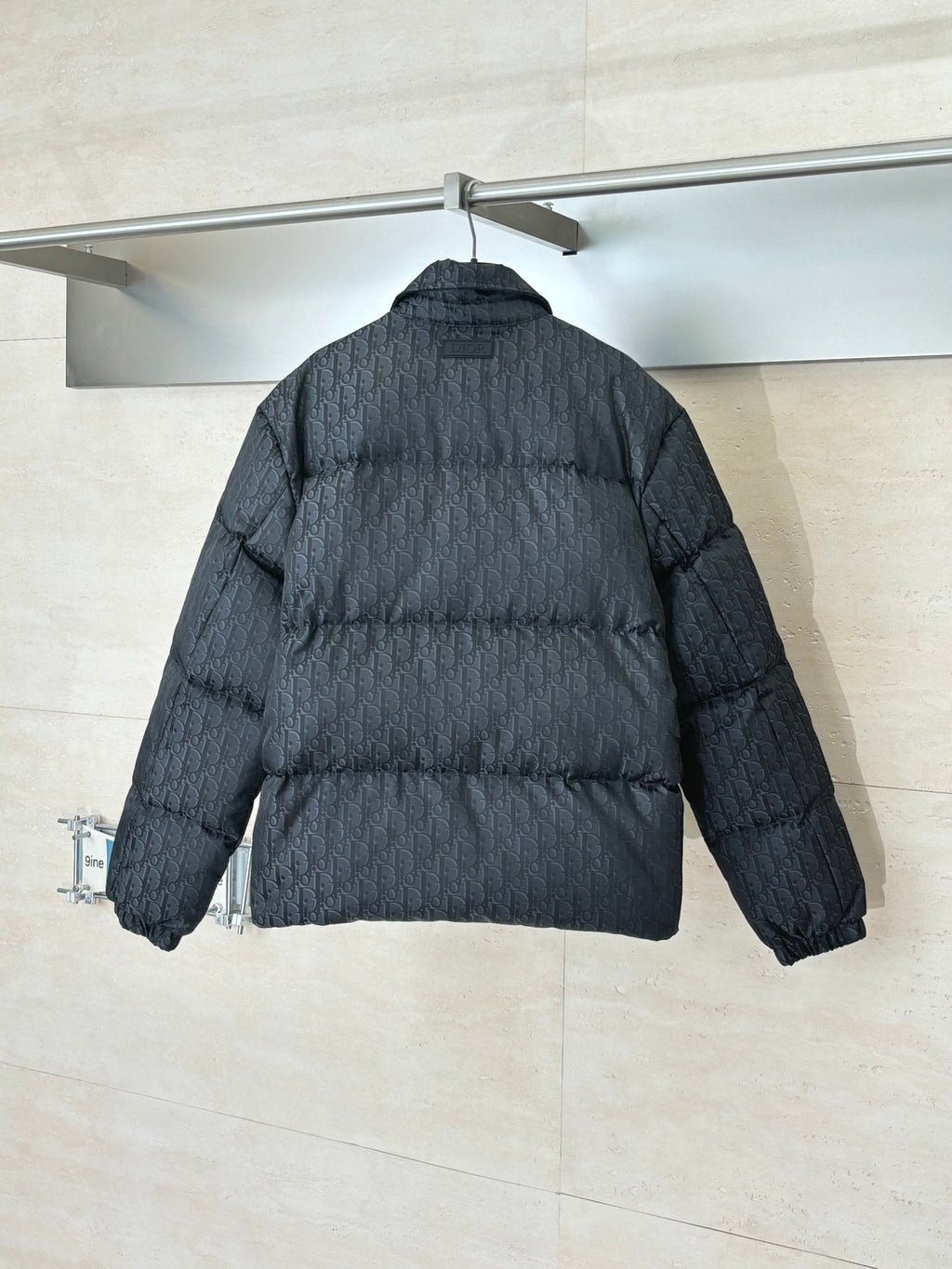 Dior long puffer jacket, dark navy, back view with quilted pattern and sleeves