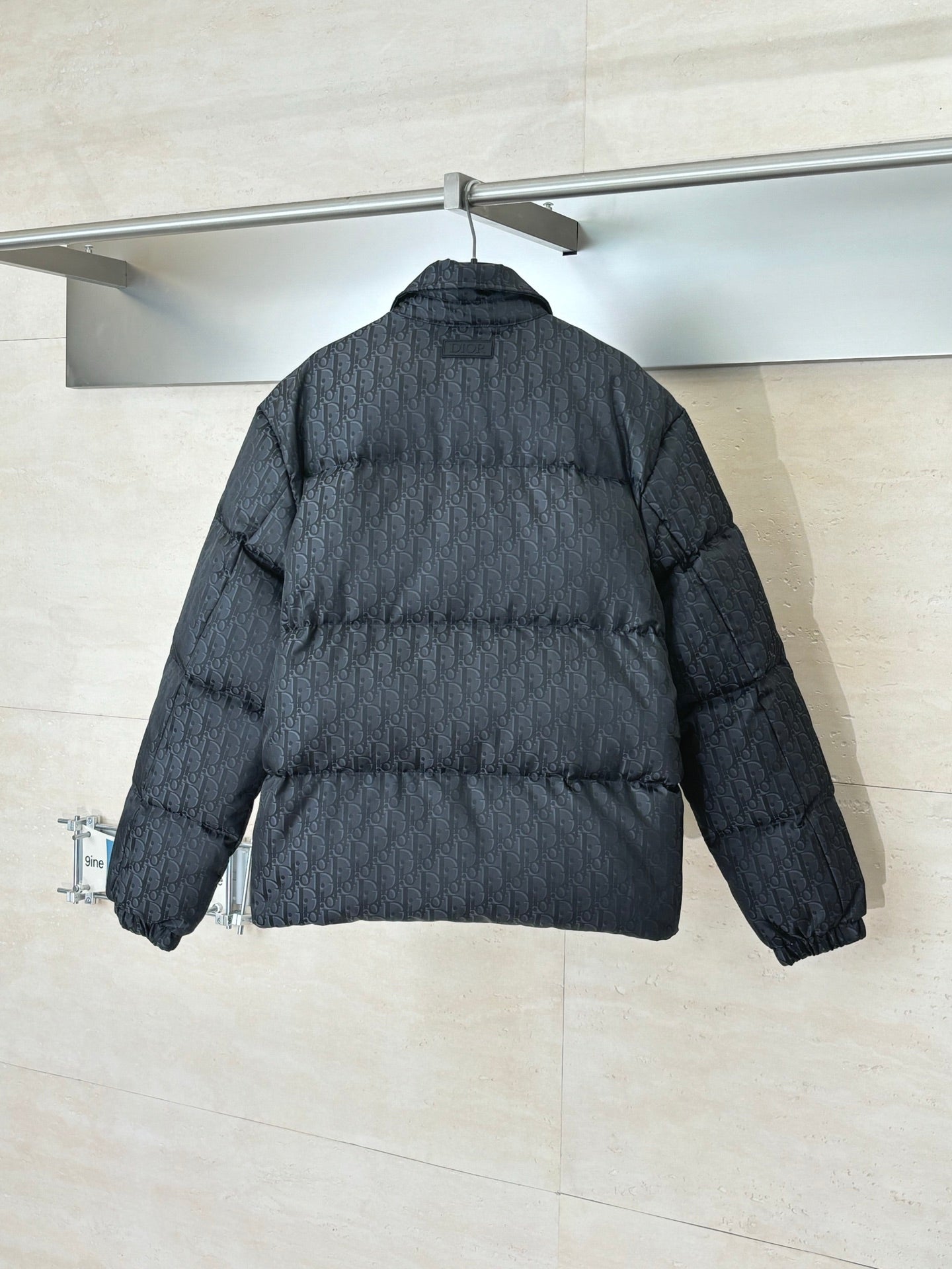 Dior long puffer jacket, dark navy, back view with quilted pattern and sleeves