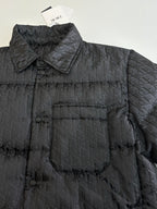 Dior long puffer jacket, dark navy, close-up of quilted monogram fabric and collar