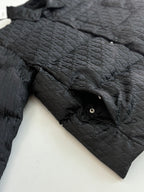 Dior long puffer jacket, dark navy, shoulder and sleeve close-up with stand collar