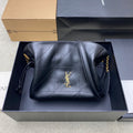 Black YSL quilted leather bag with gold logo and chain shoulder strap