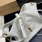 YSL bag in white quilted leather with gold YSL logo and chain crossbody strap