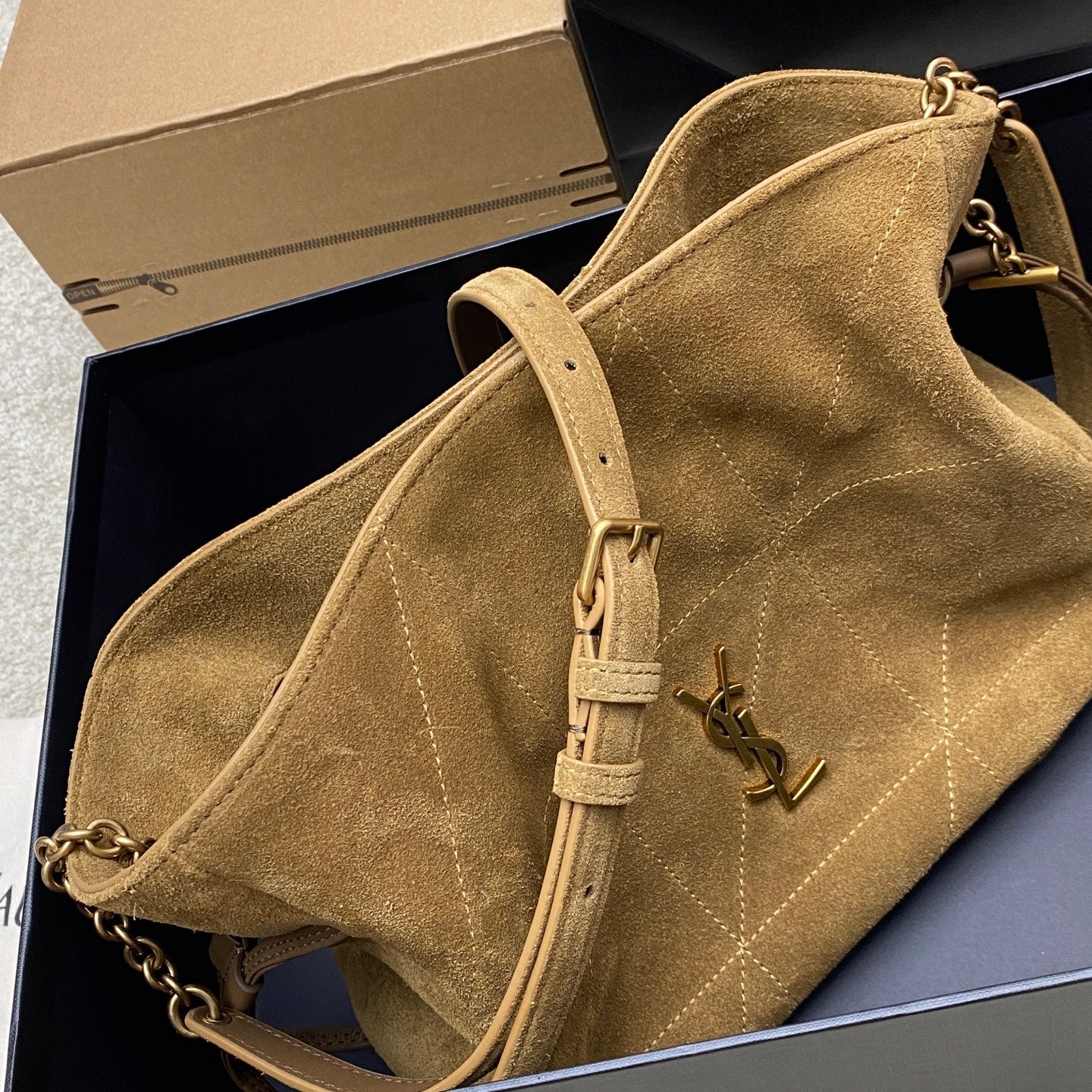YSL suede hobo bag in tan with gold YSL logo, chain strap and adjustable belt strap