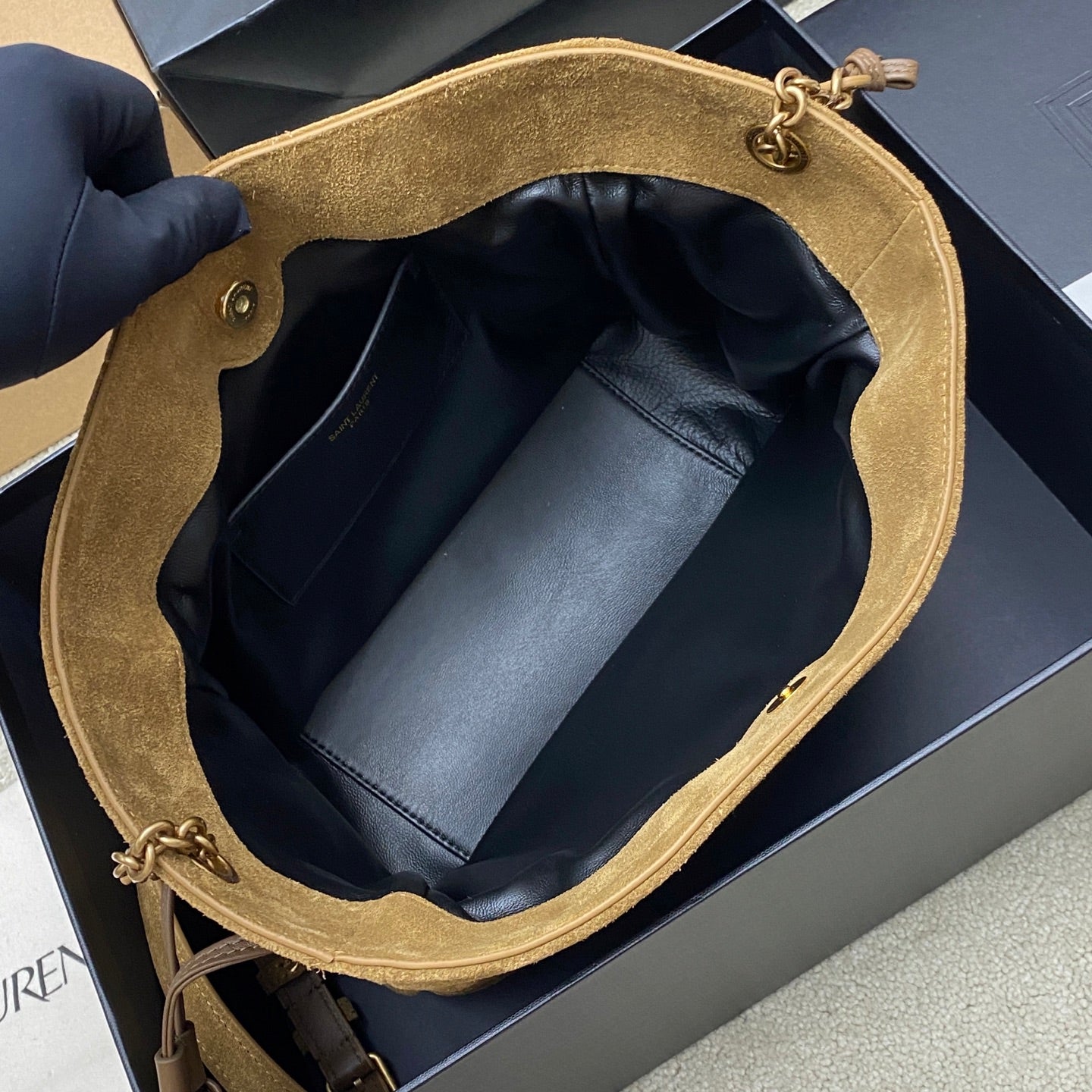 YSL suede tote-style bag in tan, open top showing inner leather lining and pocket