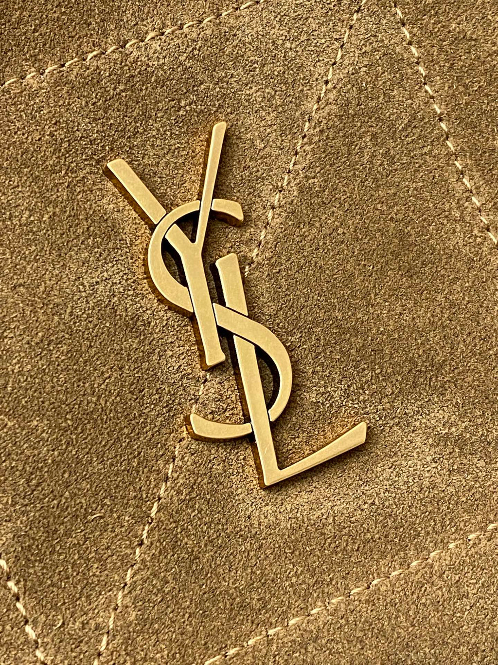 YSL gold monogram logo on tan suede bag front