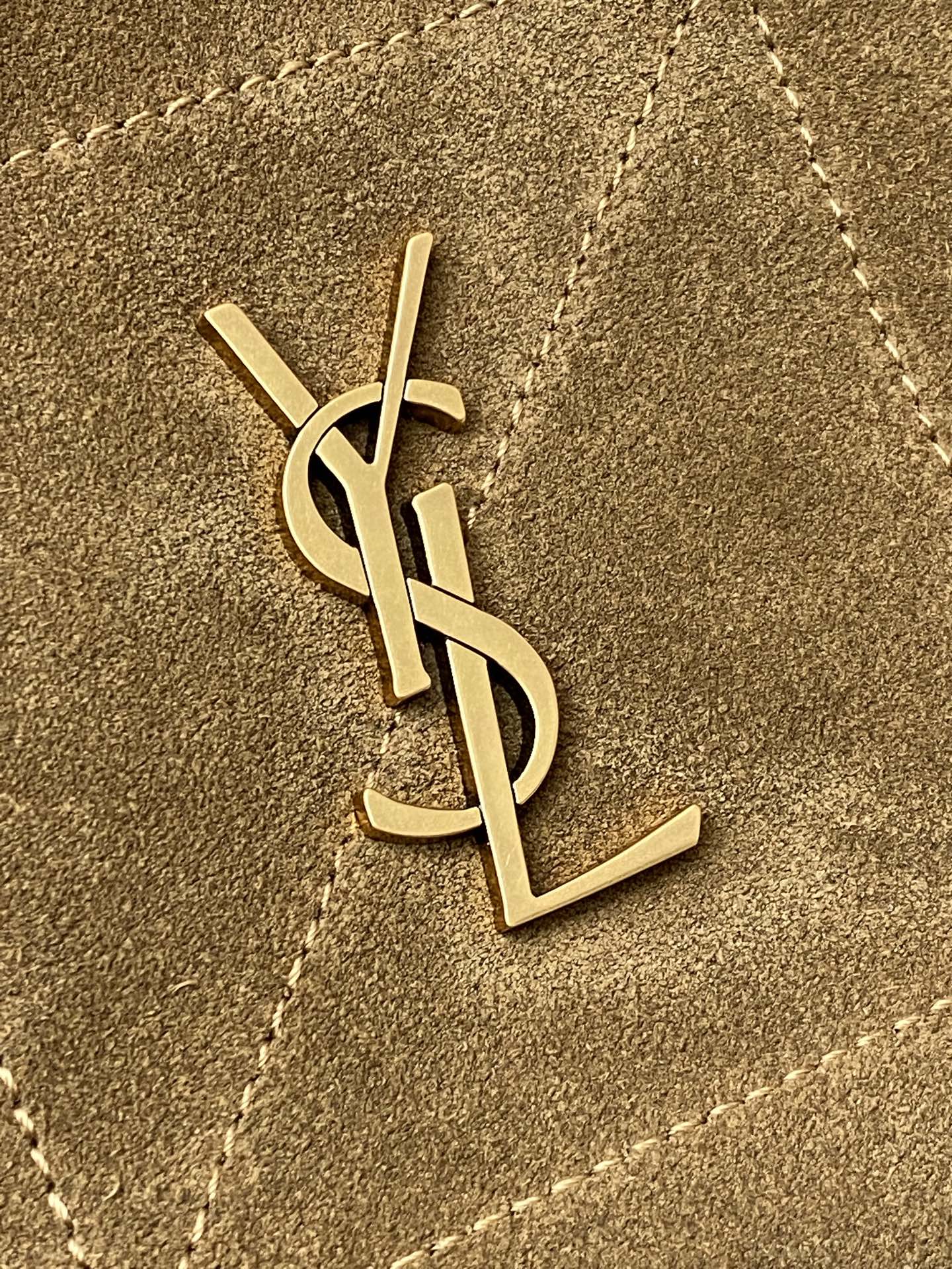 YSL gold monogram logo on tan suede bag front