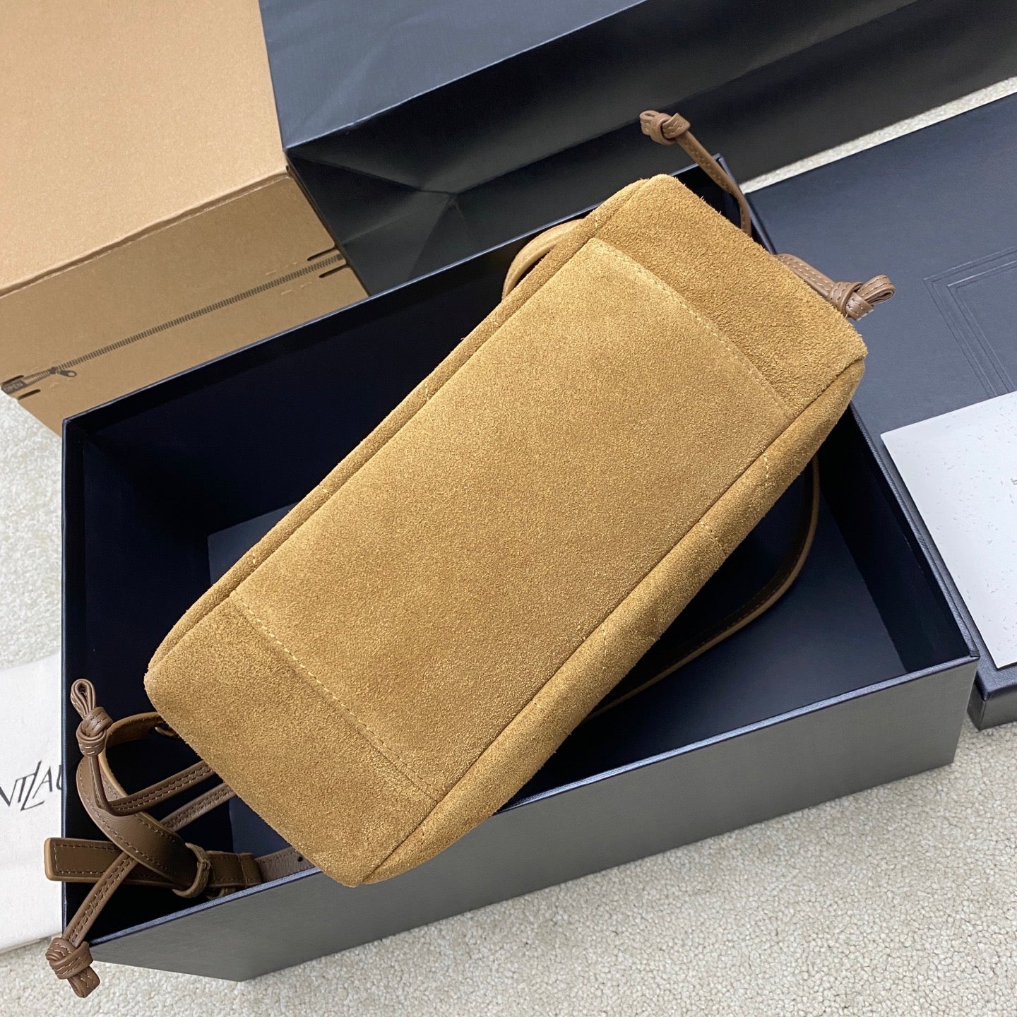 YSL suede crossbody bag, tan, with adjustable strap and top pull ties in box