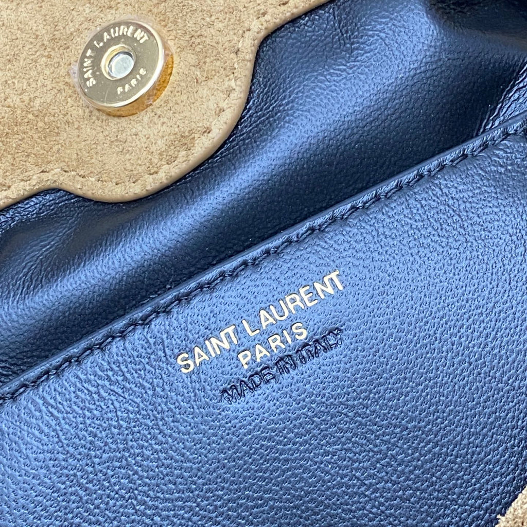 YSL 'SAINT LAURENT PARIS' stamp on blue leather lining with stitching
