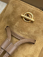 YSL round logo ring with drawcord strap detail on tan suede bag