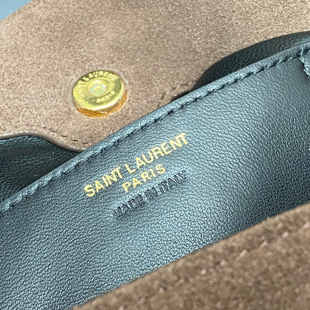 YSL interior leather label with “SAINT LAURENT PARIS” stamped in gold
