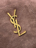 YSL logo emblem in gold on taupe suede bag