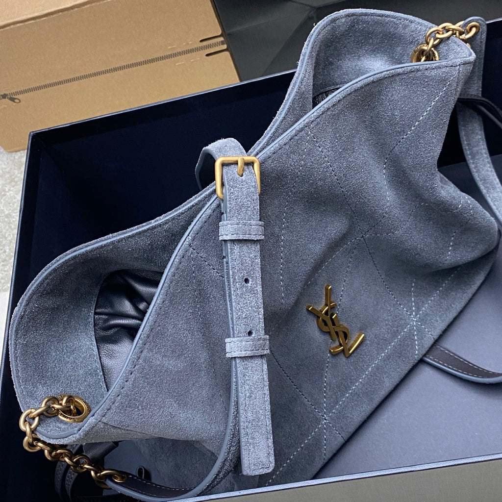 Blue-gray suede YSL bag with chain strap and gold YSL logo on front