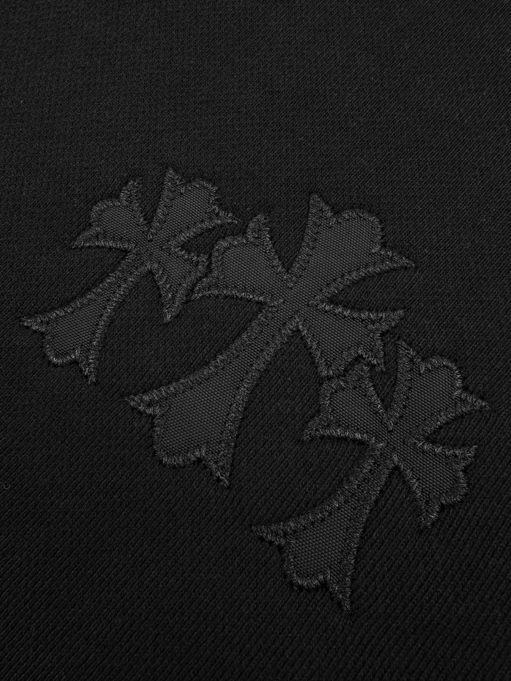 Black hoodie with embroidered emblem logo on chest