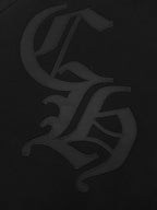 Black hoodie with large dark graphic logo on chest