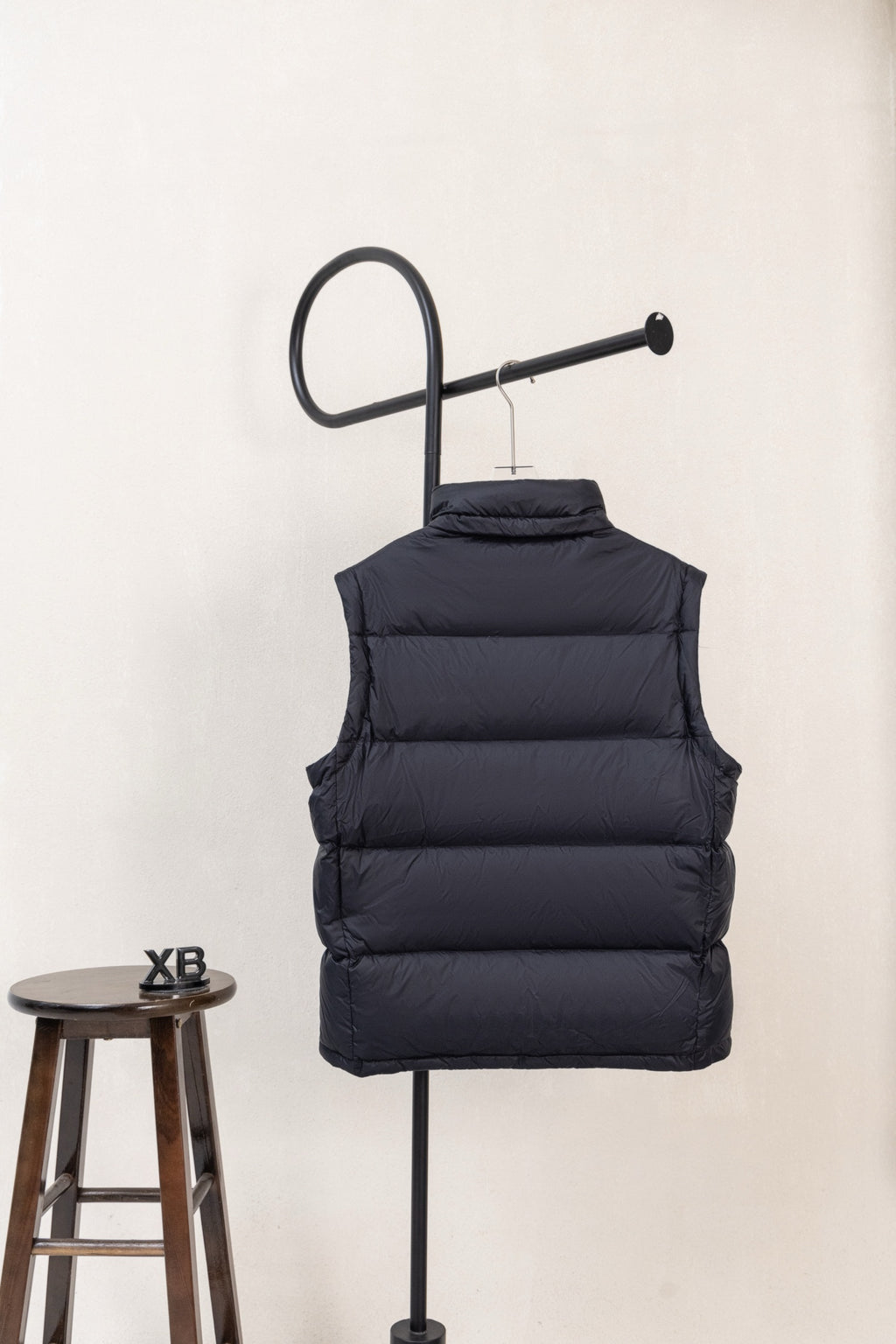 Moncler dark padded puffer vest with high collar and stitched horizontal quilting