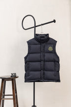 Moncler dark padded puffer vest with logo patch on chest