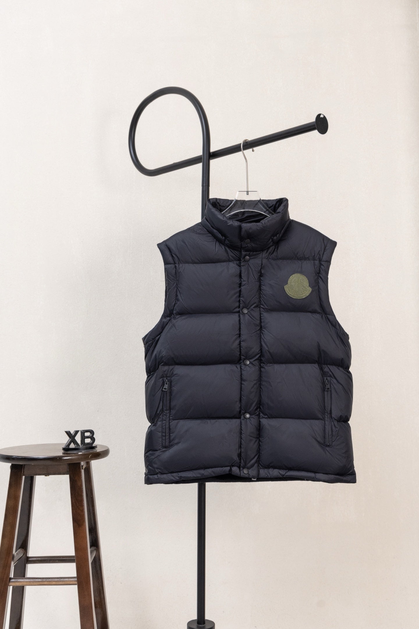 Moncler dark padded puffer vest with logo patch on chest