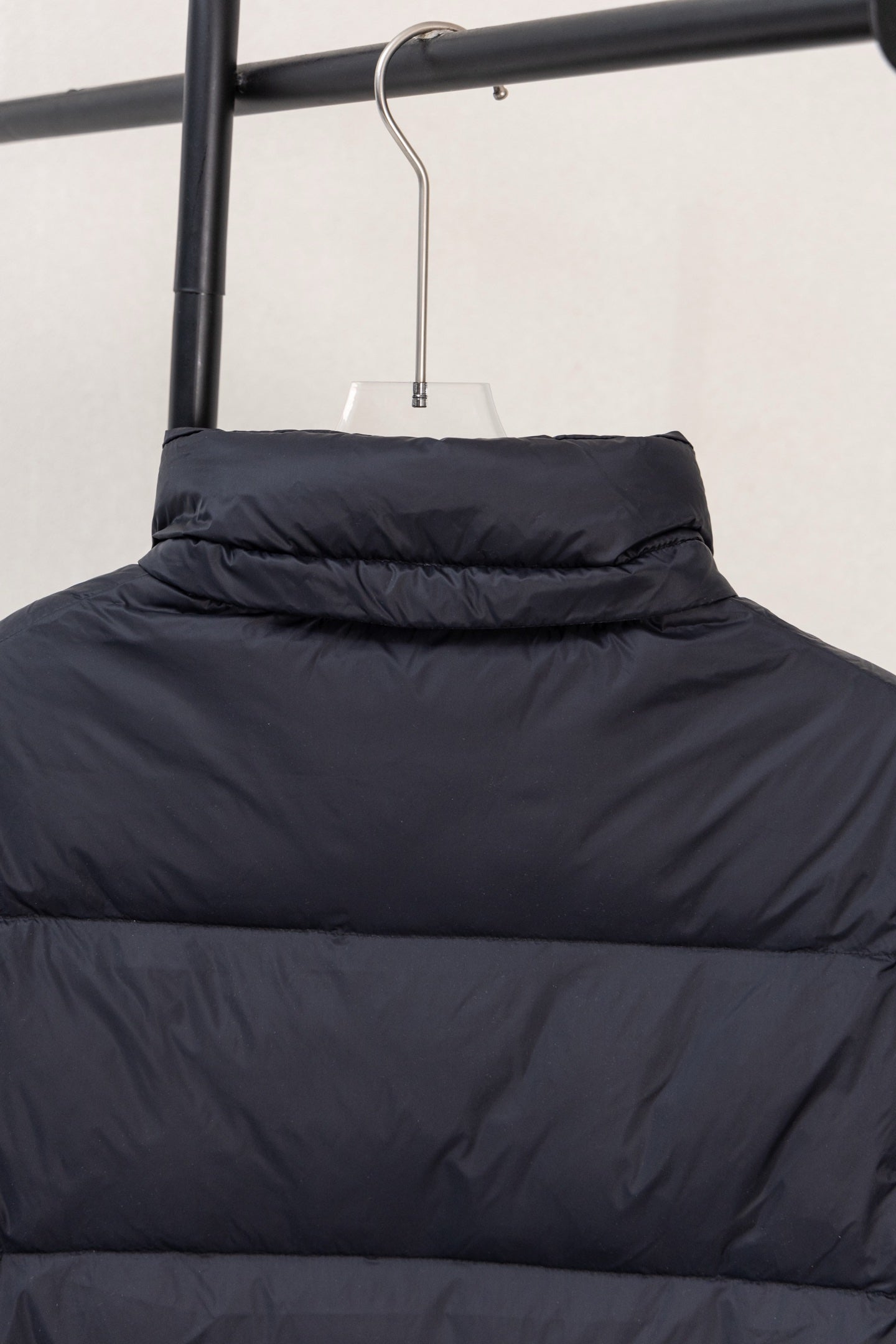 Moncler dark puffer jacket with stand collar and quilted front