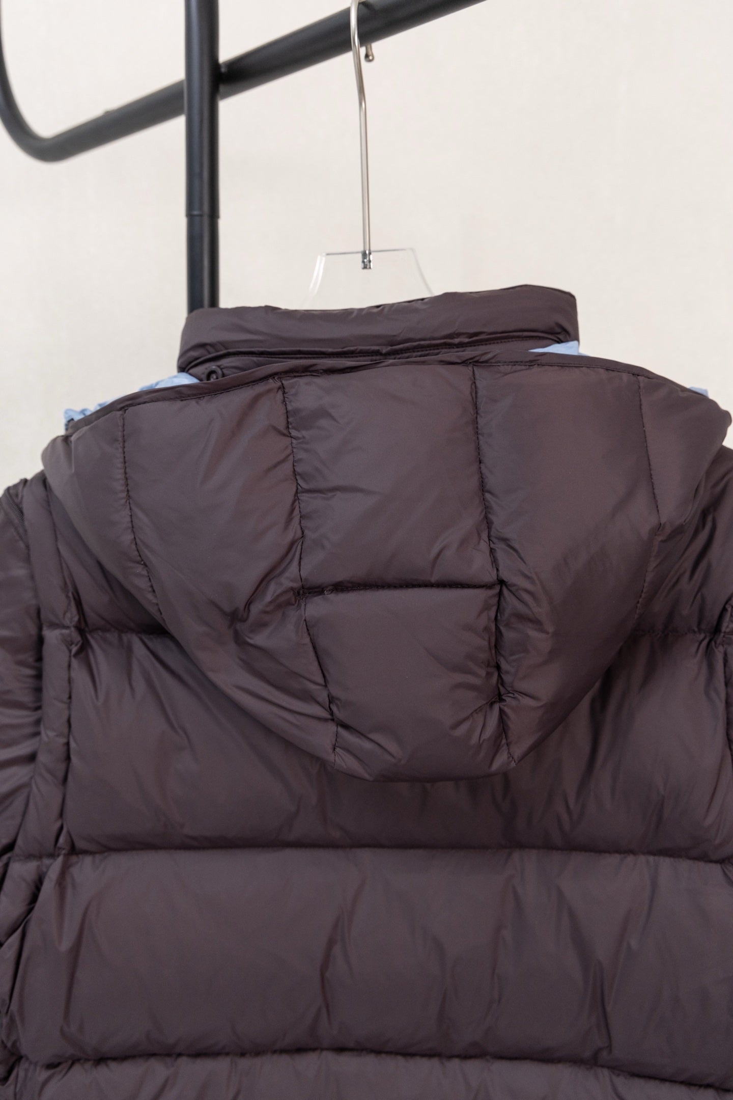 Moncler hooded puffer jacket back view with elastic hood detail, dark navy
