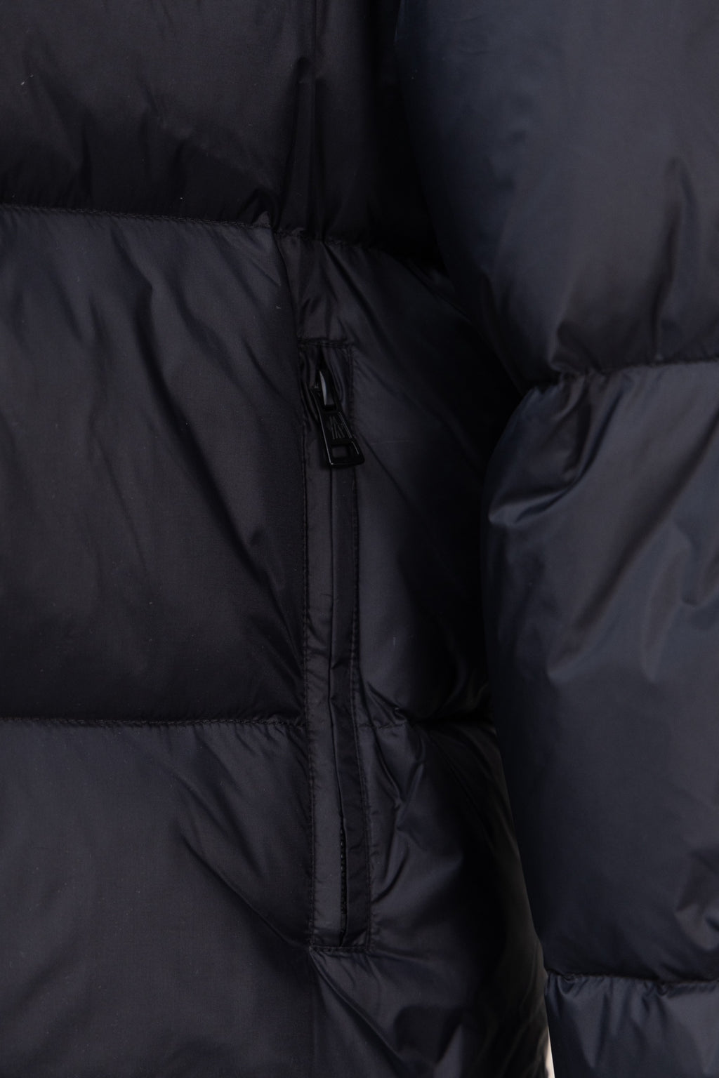 Moncler dark puffer jacket interior lining with front zipper and stitching
