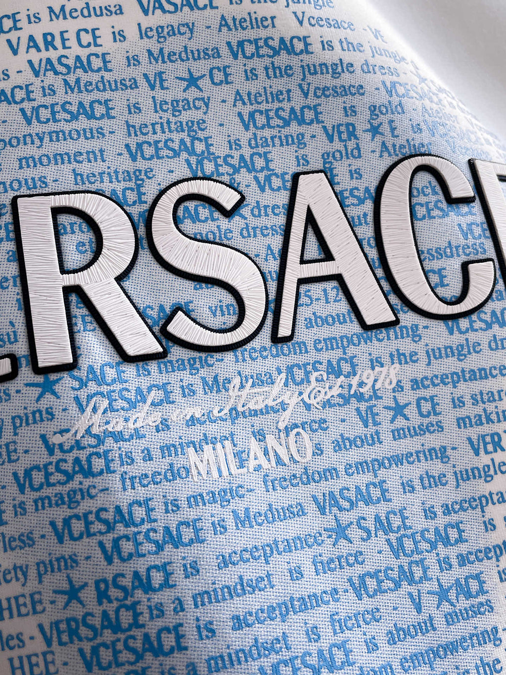 Versace white sweatshirt with oversized blue RSACE letters