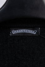 Black cardigan interior neck label with embroidered brand text