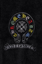 Black cardigan chest with circular multicolor embroidered emblem and arched text