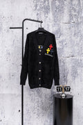 Black long-sleeve cardigan with button front and colorful embroidered chest patches