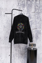 Black long-sleeve cardigan with large circular back crest embroidery and button placket