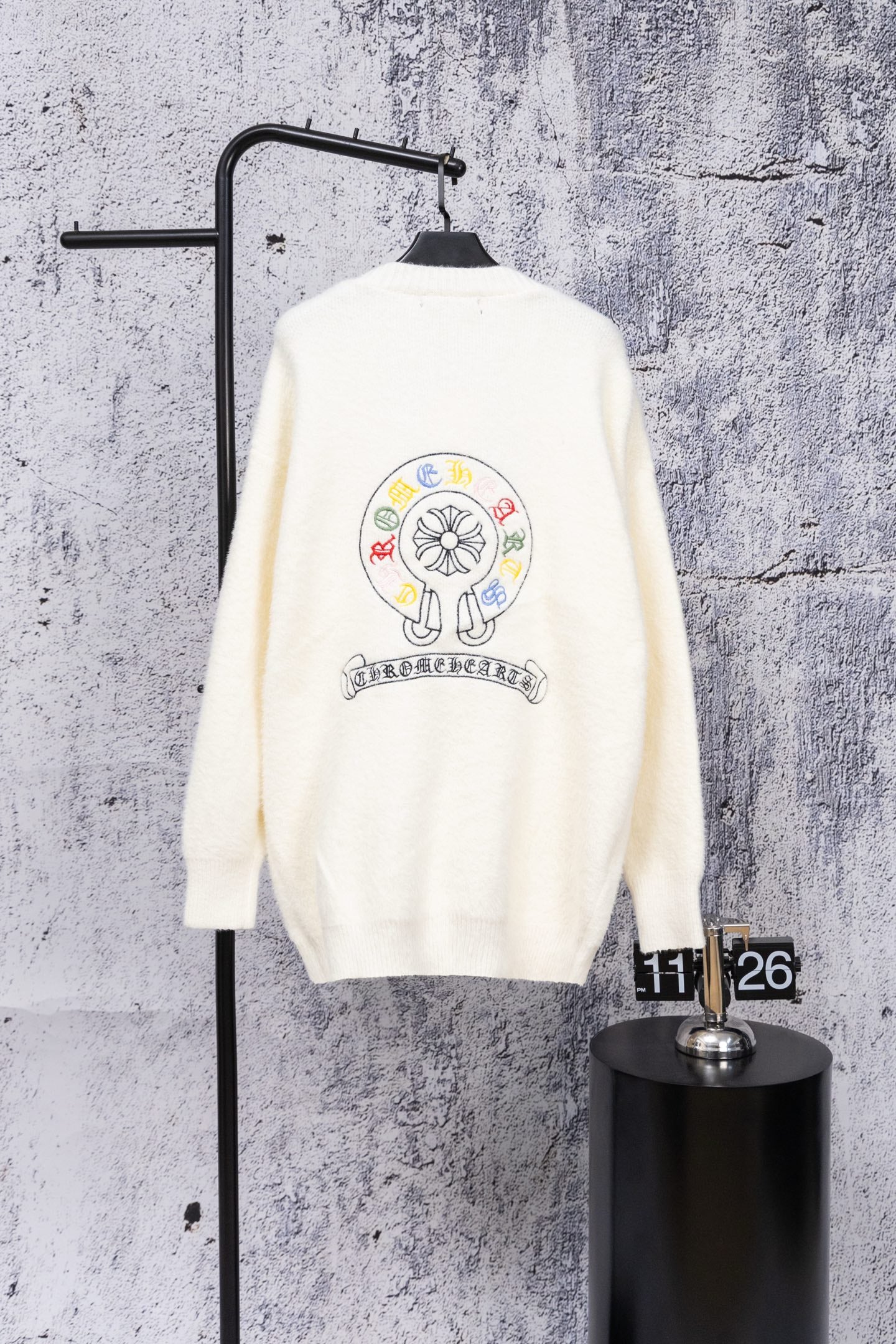 White cardigan sweater with large back graphic and button placket