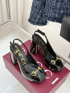 Gucci black patent platform heeled shoes with gold horsebit trim and sling heel straps